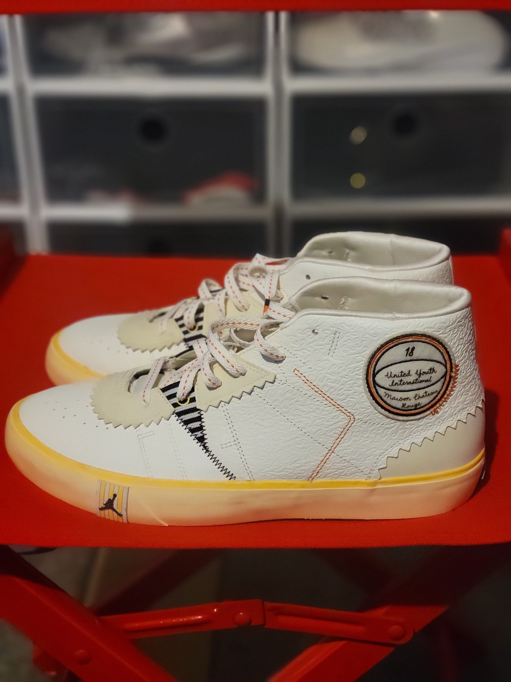 Jordan White High-Top Sneakers with Yellow Accent